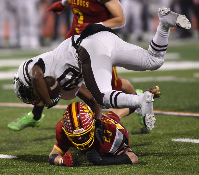 Joe Lewnard/jlewnard@dailyherald.com
Mount Carmel running back Alonzo Manning II gets tackled by Batavia's defensive back Drake Ostrander during the Class 7A football state title game at Memorial Stadium in Champaign on Saturday, Nov. 26, 2022.