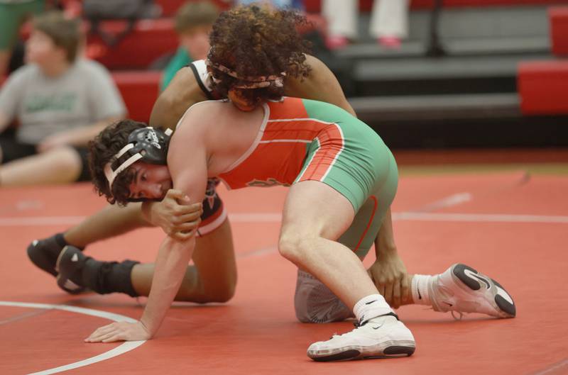 Ottawa's Anthony Juarez, wrestles L-P's Jake Mueller,  during a meet on Thursday Jan. 8, 2026 in Kingman Gymnasium at Ottawa High School.