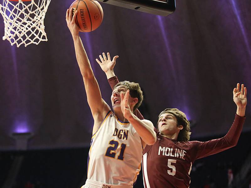 Downers Grove North's Jack Stanton drives to the hoop as Moline's Braden Freeman guards from behind during the Class 4A state semifinal game on Friday, March 10, 2023 in Champaign.