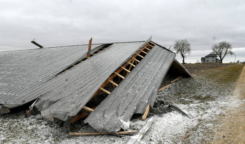 Friday's storm ripped the roof off the Gempeler's machine shed tossing it several 100 yards from their home (seen in the background) along Illinois 72 northwest of Forreston.