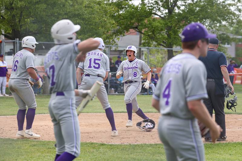 Wilmington's Kyle Farrell celebrates as he scores a run during the Wildcats' 7-2 victory over Chicago Christian in the IHSA Class 2A Beecher Sectional semifinal on Thursday, May 29, 2025.
