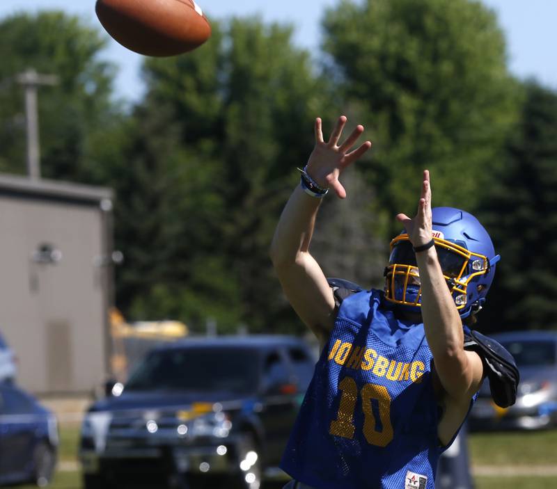 Cade Piggott catches the ball during summer football practice Thursday, June 23, 2022, at Johnsburg High School in Johnsburg.