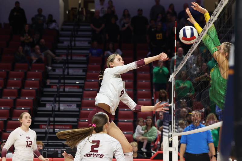 Prairie Ridge's Harleigh Serpico spikes into a block to lose the game point during the Wolves' loss in two sets, 25-20, 25-18, in the IHSA Class 3A State semifinals on Friday, Nov. 14, 2025.