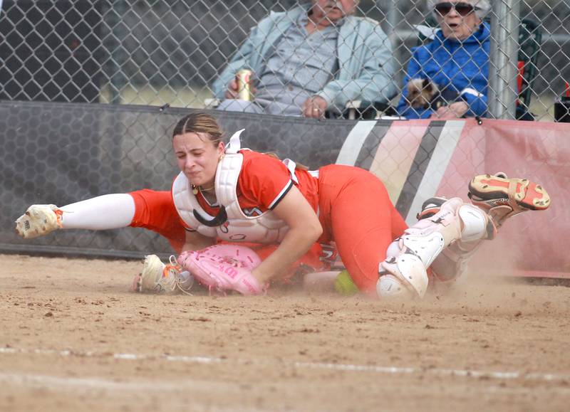 St. Charles East catcher Hayden Sujack (right) collides with first baseman St. Charles East's Holly Smith during a game against Downers Grove North on Friday, March 28, 2025 in St. Charles.
