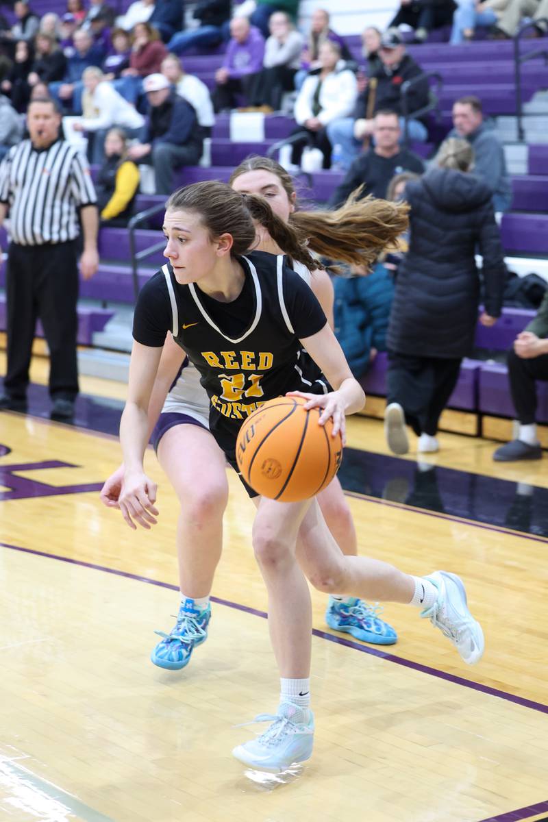 Reed-Custer's Alyssa Wollenzien drives along the baseline against Manteno's Emily Horath during Reed-Custer's 45-42 victory over Manteno on Monday, Feb. 2, 2026.