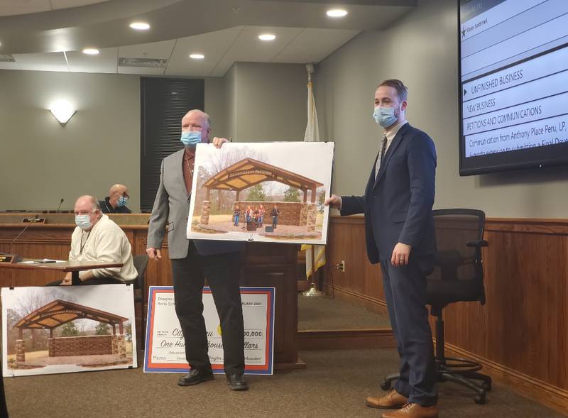 During Monday evening’s city council meeting Mayor Scott Harl was presented the first check from Douglas J. and Rorie Schweickert and the rest of the Schweickert family. In attendance to present the $100,000 check was Douglas J. and Rorie’s son Scott Schweickert who also serves as the city’s Assistant Corporate Counsel.