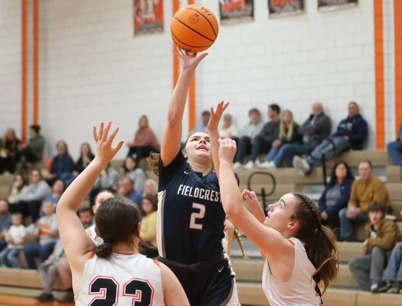 Fieldcrest's Pru Mangan shoots a jump shot over Flanagan-Cornell/Woodland's Chandler Weber during the Falcon-Irish Thanksgiving Tournament on Monday, Nov. 18, 2024 at Flanagan High School.