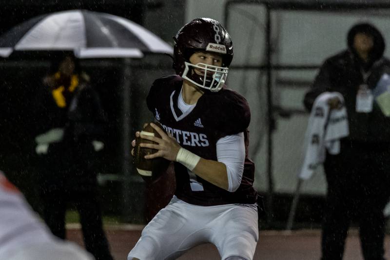 Lockport's Brendan Mecher looks for an open teammate during an 8A varsity football playoff game against Homewood-Flossmoor at Lockport Township High School East Campus on Nov. 8, 2025.