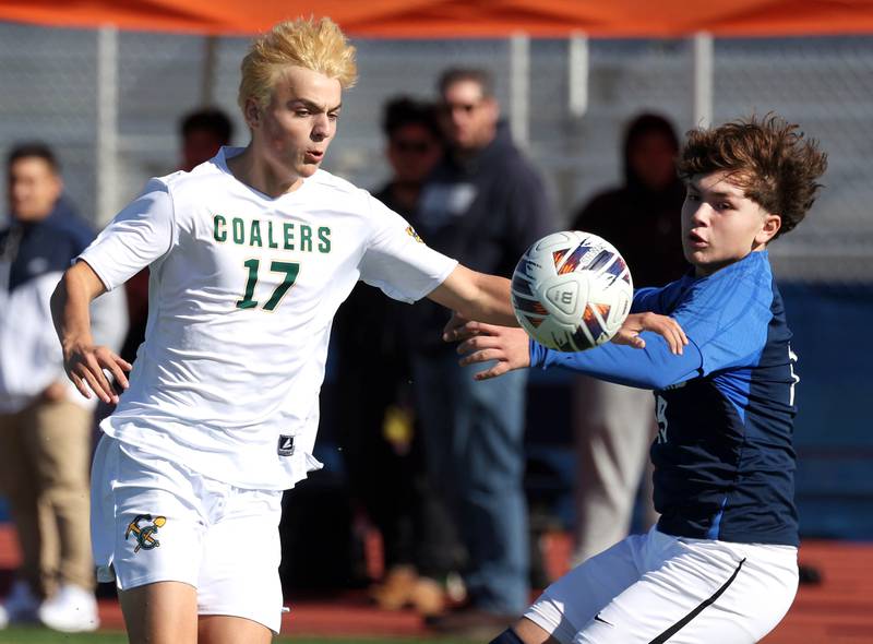 Coal City's Adrian Dames and Chicago Academy's Andrew Garcia try to play a ball in the air Friday, Nov. 7, 2025, during their Class 1A state third place game at Hoffman Estates High School.