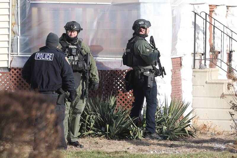 Joliet police stand at the corner of Youngs Avenue and Irving Street during a standoff on Thursday, Jan. 9, 2025 in Joliet.