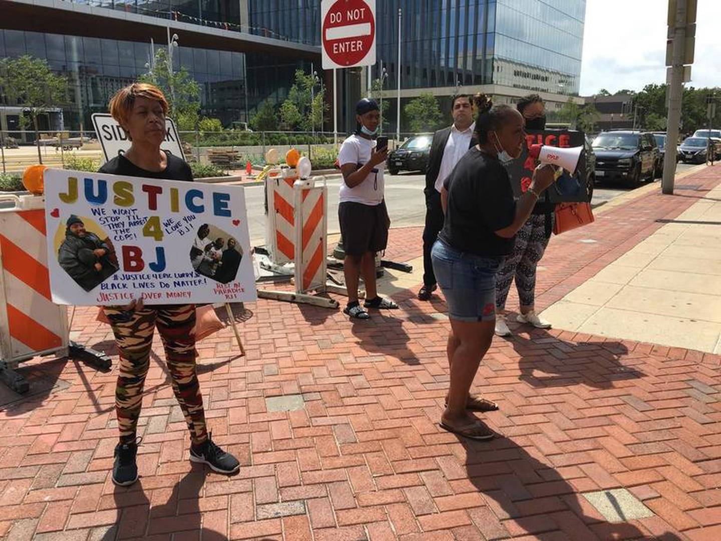 Protesters hold rally against Will County State's Attorney James Glasgow in response to the death of Eric Lurry on Monday, Aug. 10, 2020, in downtown Joliet.