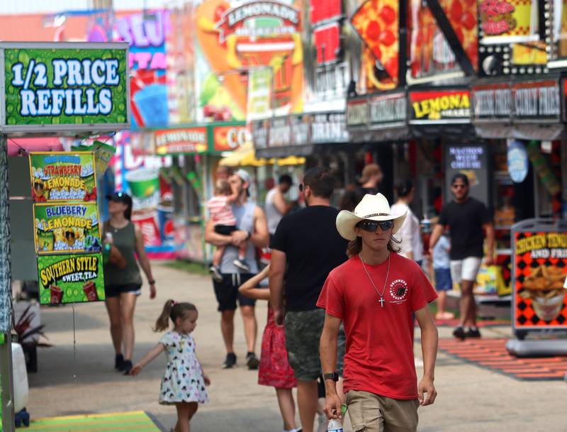 Fairgoers walk on the final day of the 2025 McHenry County Fair in Woodstock on Sunday, August 3, 2025.