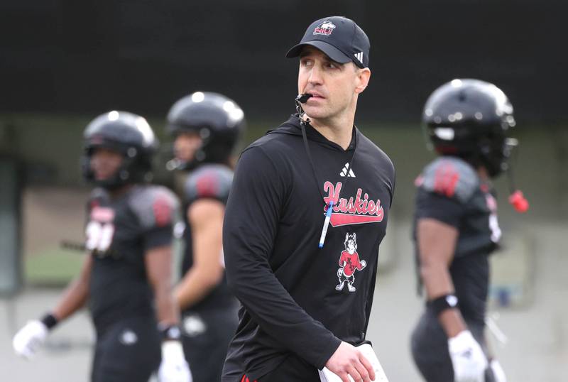 Northern Illinois University head football coach Rob Harley watches his team Tuesday, April 14, 2026, during spring practice in Huskie Stadium at NIU in DeKalb.