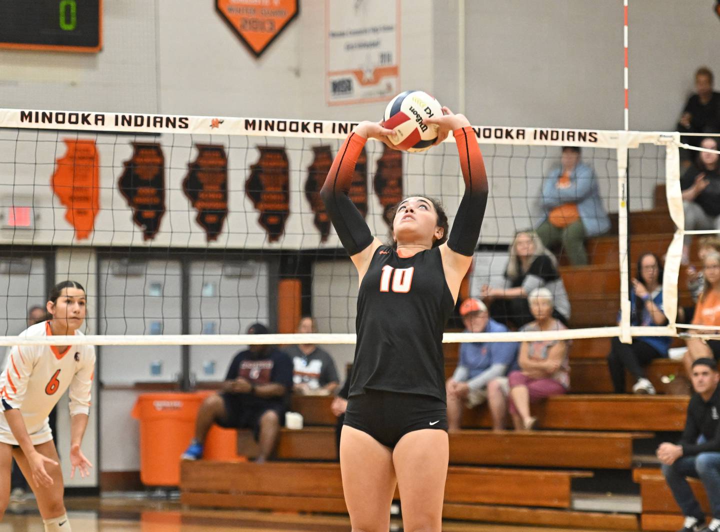 Minooka's Ava Valentin sets the ball during a conference game against Romeoville on Tuesday, Oct. 03, 2023, at Minooka. (Dean Reid for Shaw Local News Network)