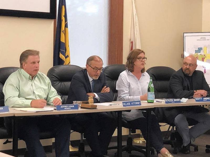 East Dundee President Jeff Lynam, left, continued his efforts to appoint a trustee to replace Scott Andresen, right, at a special board meeting Monday, June 14, 2021.