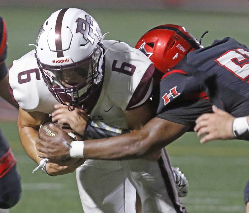 Prairie Ridge's Luke Vanderwiel is tackled by  Huntley's Ethan Albertson during a Fox Valley Conference football game on Friday, Sept. 20, 2024, at Huntley High School.