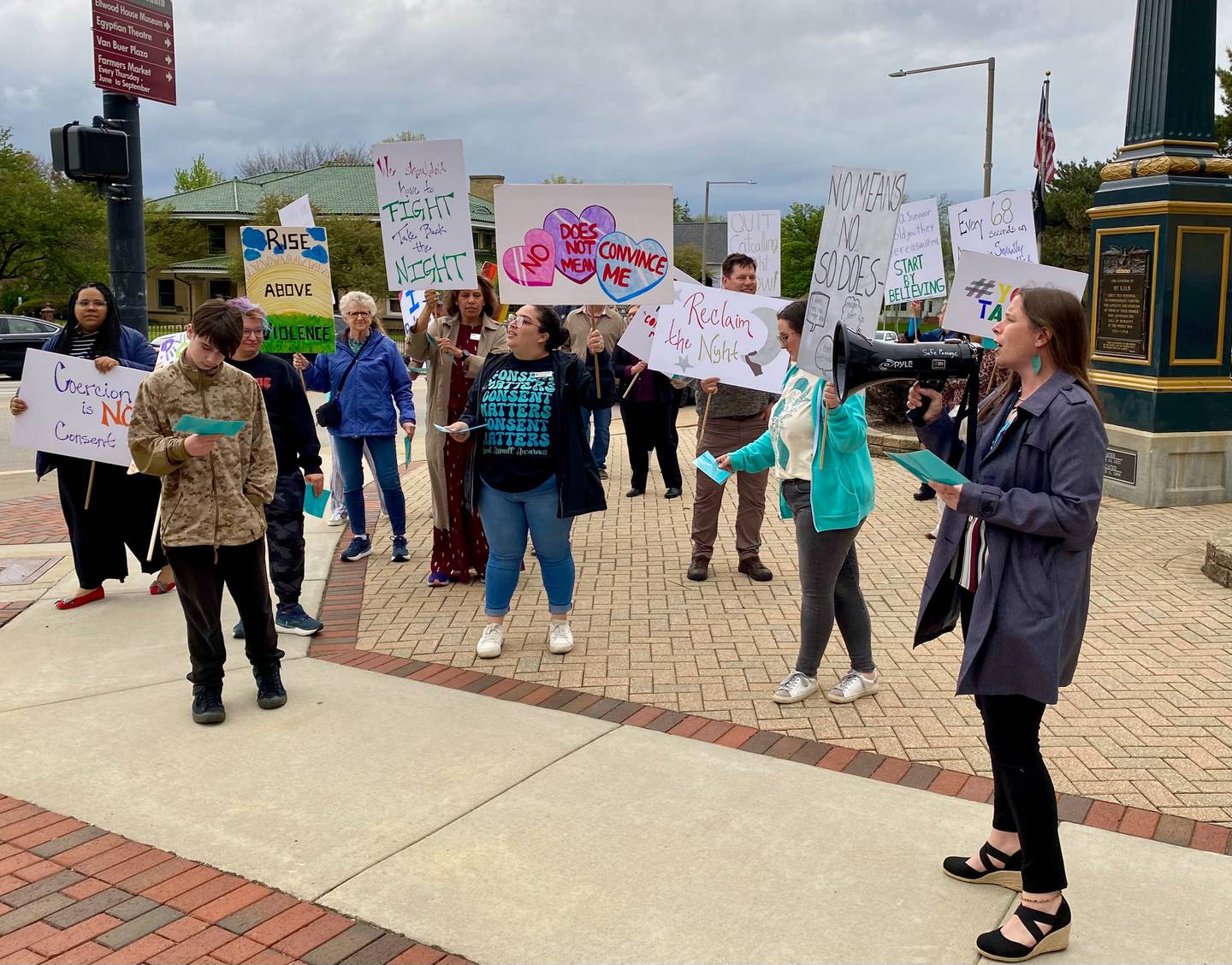 Event-goers at Safe Passage's annual Take Back the Night chant together in downtown DeKalb on Monday, April 27, 2026. They carried signs to advocate against sexual violence and to mark Sexual Violence Awareness Month, in its 25th year.