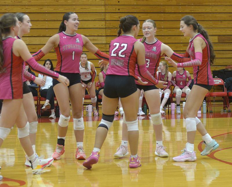 The Lady Bulldogs celebrate taking the lead against Wilmington during the 2nd set of Tuesday’s match at Streator.