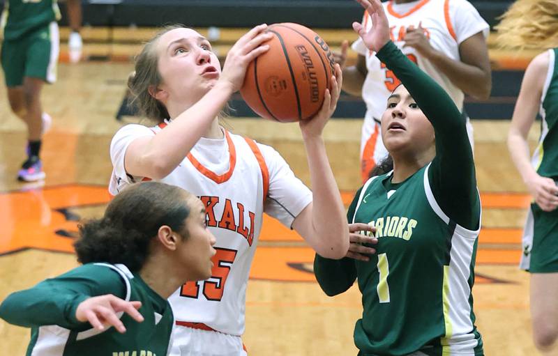 DeKalb's Kailey Porter drives between two Waubonsie Valley defenders during their game Thursday, Dec. 15, 2022, at DeKalb High School.