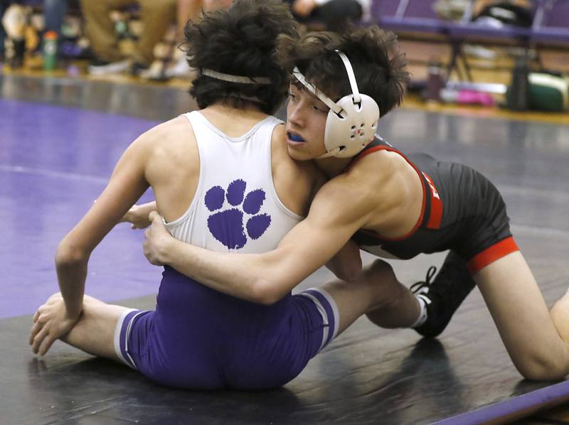 Huntley's Colin Abordo tries to take down Hampshire's Deegan Kirschke during the 113-pound match of a Fox Valley Conference wrestling meet on Wednesday, Jan. 8, 2025, at Hampshire High School.