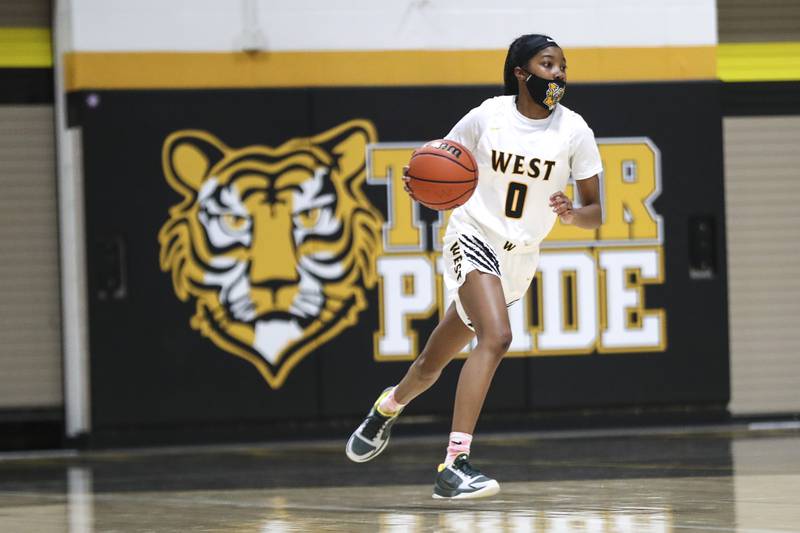 Joliet West's Lisa Thompson dribbles out of the back court on Tuesday, Feb. 16, 2021, at Joliet West High School in Joliet, Ill.