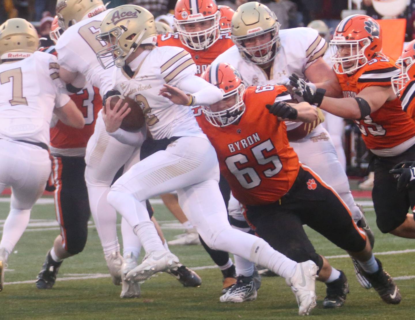 Mt Carmel's Blayne Sisson runs the ball as Byron's Jared Claunch makes the tackle during the Class 3A State football championship on Friday, Nov, 24, 2023 at Hancock Stadium in Normal.