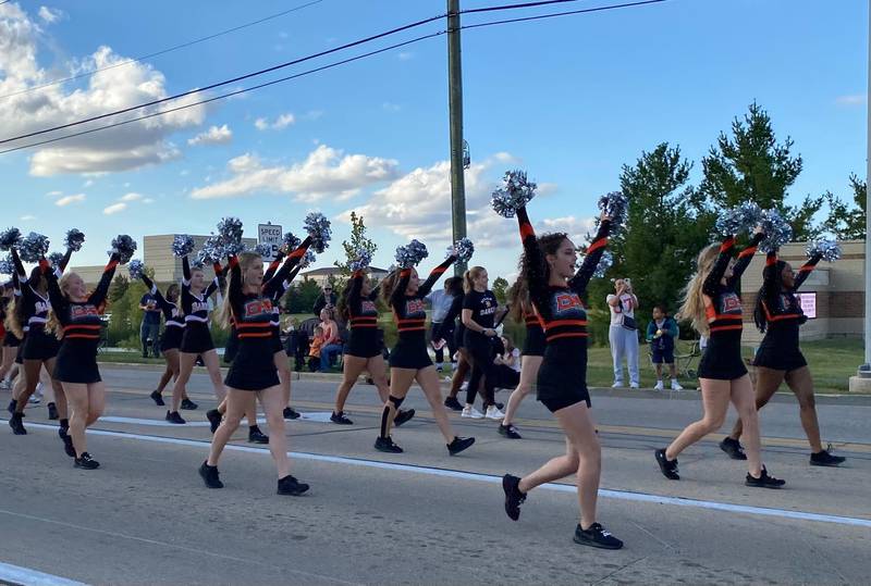 DeKalb High School cheerleaders spread some school spirit on Wednesday, Sept. 24, 2025, at the 2025 DeKalb High School Homecoming Parade along West Dresser Road.