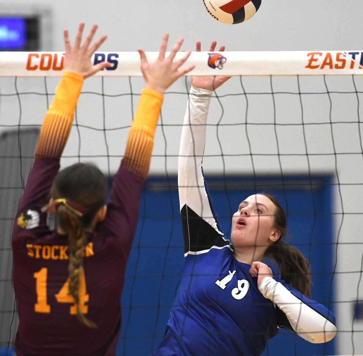 Newark's Bella Dierzen (19) directs the ball as Stockton's Emma Eisfeller (14) goes up to block at the 1A Eastland sectional on Tuesday, Nov. 4, 2025 in Lanark.