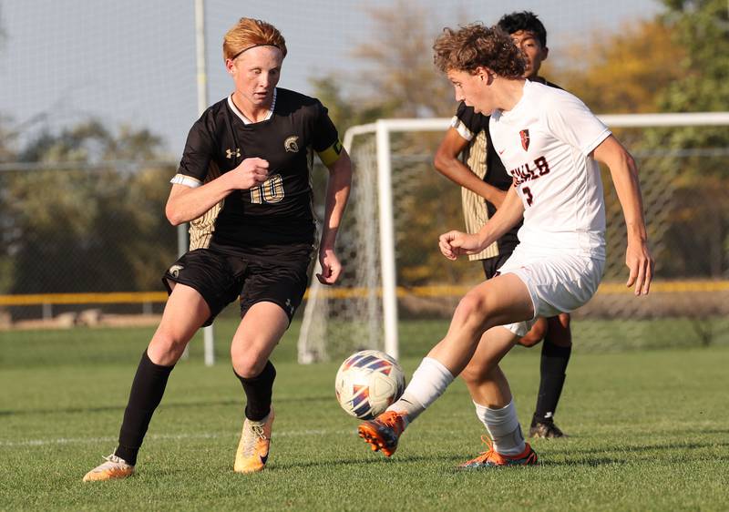 Sycamore's Jameson Carl (left) tries to stop DeKalb's Jack Ager during their game Tuesday, Oct. 3, 2023, at Sycamore High School.