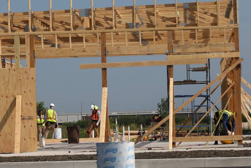 Crews begin on erecting the walls of the new Popeye's location next to Super 8 on Monday, Aug. 2024 in Peru.