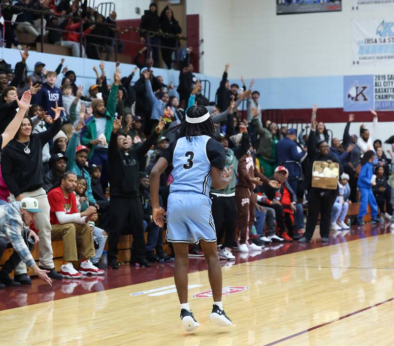 The crowd erupts as Kankakee's Cedric Terrell III celebrates hitting the go-ahead 3-pointer in the fourth quarter during the Kays' 54-50 victory over Lincoln-Way Central in the 75th Kankakee Holiday Tournament maroon bracket championship on Sunday, Dec. 28, 2025.