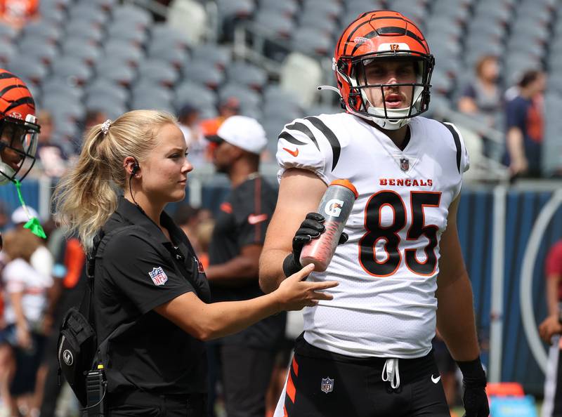 Cincinnati Bengals tight end Cam Grandy grabs a drink during warmups Saturday, Aug. 17, 2024, before his team plays the Chicago Bears at Soldier Field in Chicago.