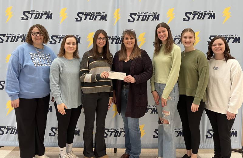 Bureau Valley High School National Honor Society Present $295.00 to Kathy Barker for Barker Farm Pictured are NHS officers and advisers presenting a check to Kathy Barker. Pictured left to right: Co-