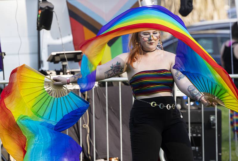 Sydney Brown dances with colorful fans Saturday, June 14, 2025, during Sauk Valley Pride Fest in Dixon.