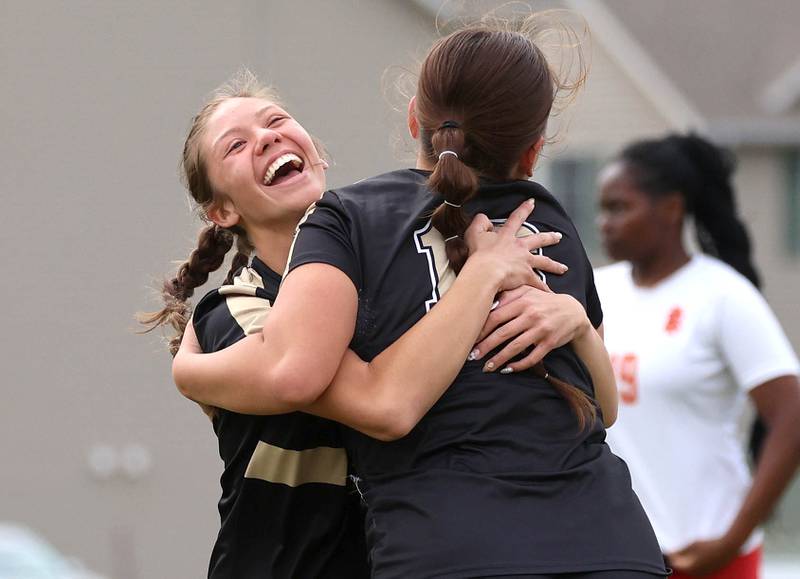 Sycamore's Charlotte Yates (right) celebrates after scoring a goal against Rock Island with teammate Addison  Rodriguez Friday, May 22, 2026, during their Class 2A regional championship matchup at Sycamore High School.