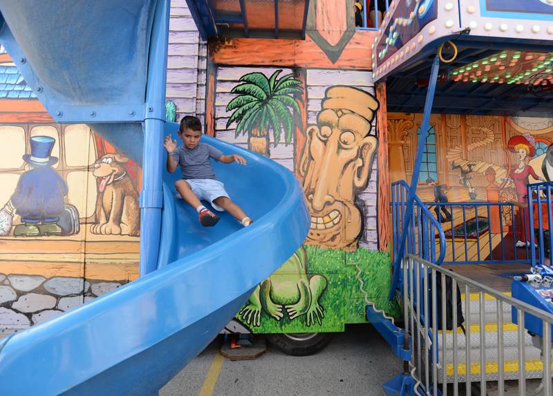 Children including Graham Zambrano of Berwyn completes the fun house while attending the La Grange Summerfest Saturday Aug 6, 2022.