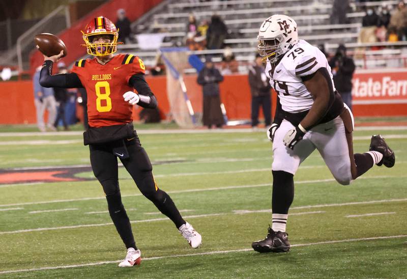 Batavia's Michael Vander gets rid of the ball ahead of the pressure of Mt. Carmel's Caleb Tucker during their Class 8A state championship game Saturday, Nov. 30, 2024, in Hancock Stadium at Illinois State University in Normal.
