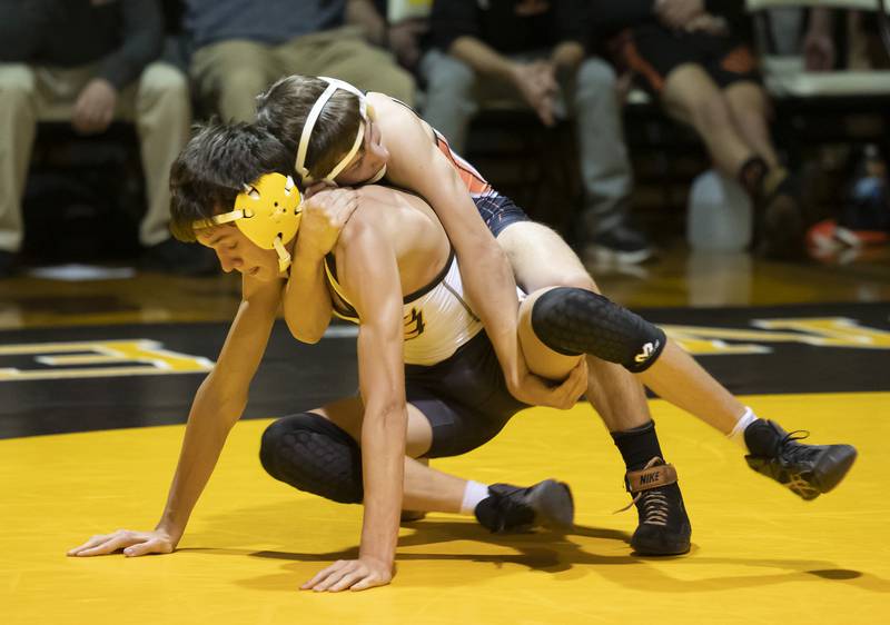 McHenry's Lucas Van Diepen lifts Jacobs' Trevor McCraw during the 120 pound match on Thursday, December 9, 2021 at Jacobs High School in Algonquin.