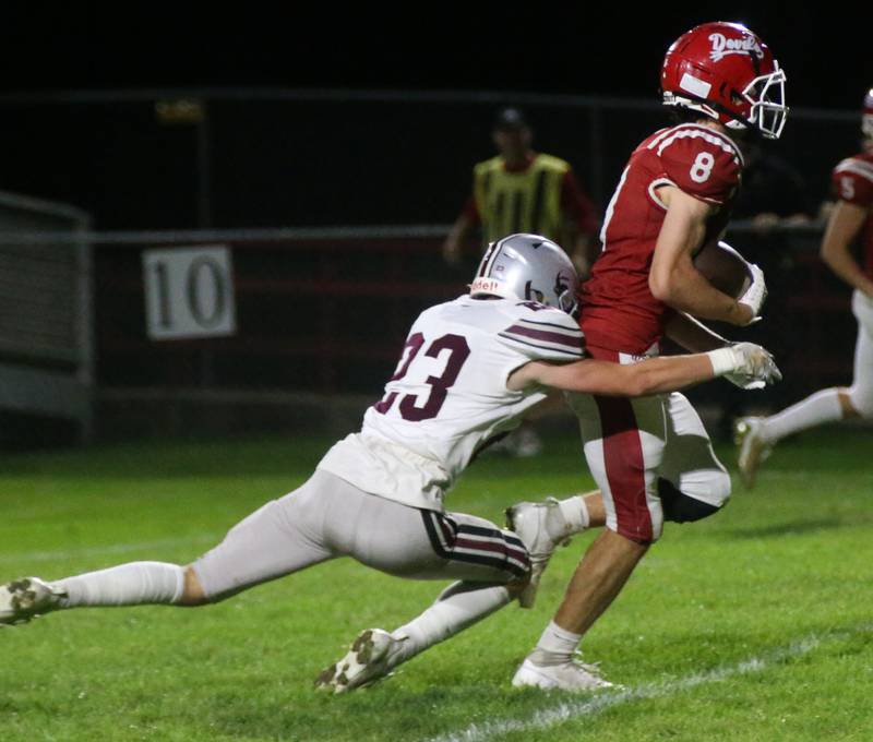 Hall's Braden Curran runs the football as he is brought down from behind by Illinois Valley Central's Tyler Suhr on Friday, Sept. 29, 2023 at Richard Nesti Stadium.
