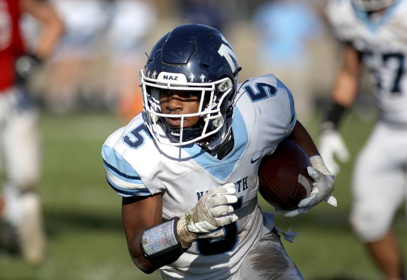 Nazareth's Kaleb Miller carries the ball during a Class 5A second-round game at Marmion in Aurora on Saturday, Nov. 6, 2021.