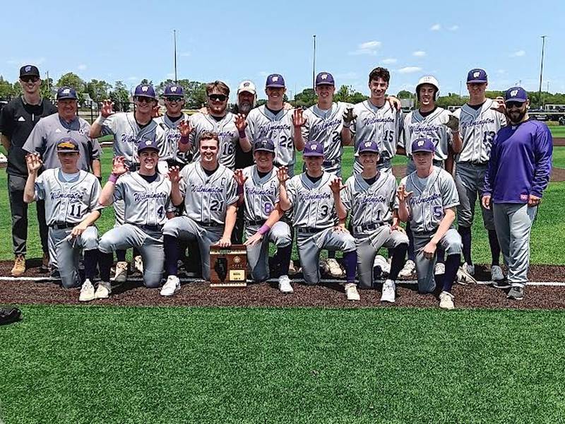 Wilmington celebrates with its hardware after defeating Coal City 1-0 at the Class 2A Coal City Regional on Saturday.