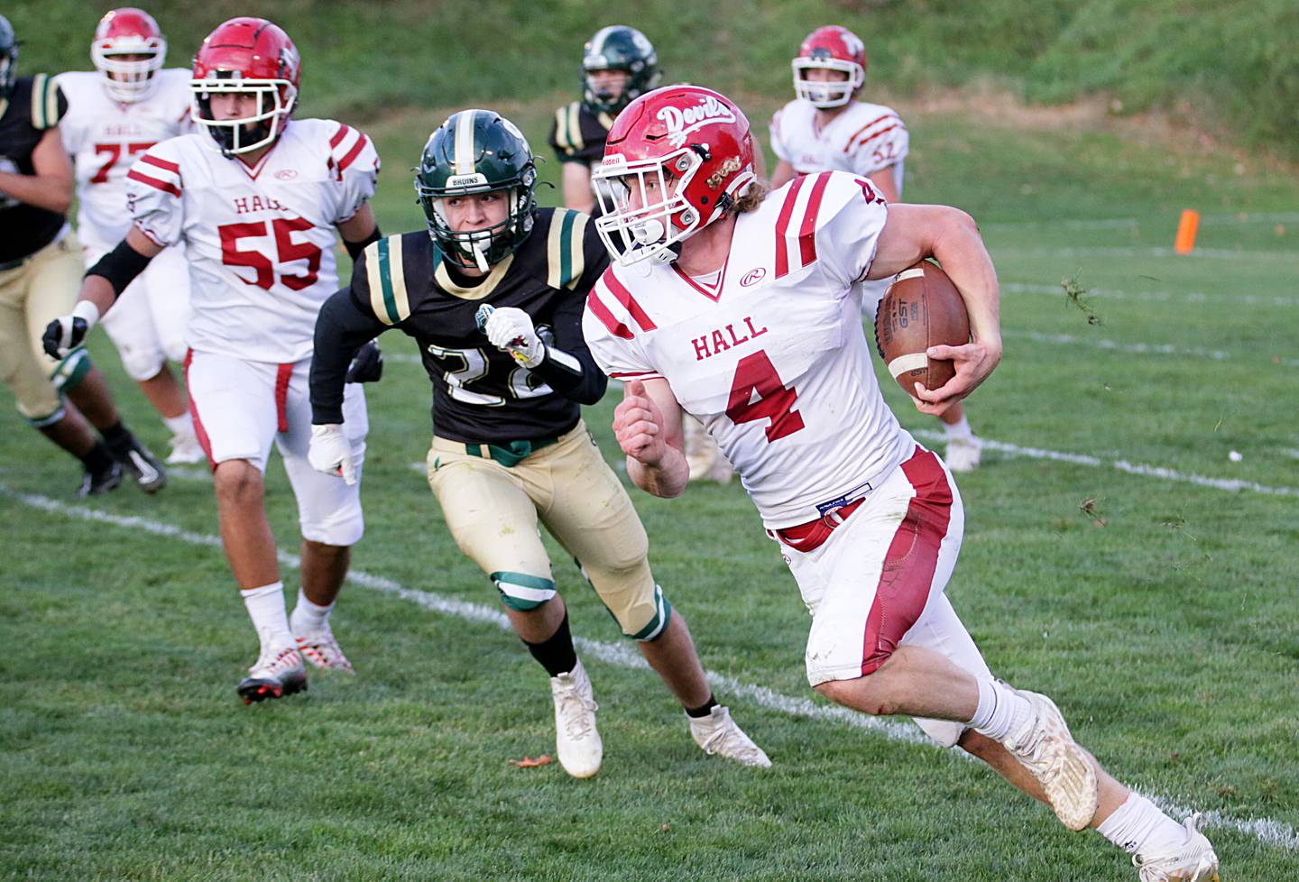 Hall's Mac Resetich (4) runs the ball into the endzone as he gets by St. Bede's Halden Hueneburg (22) on Saturday, Oct. 15, 2022 at the Academy in Peru.