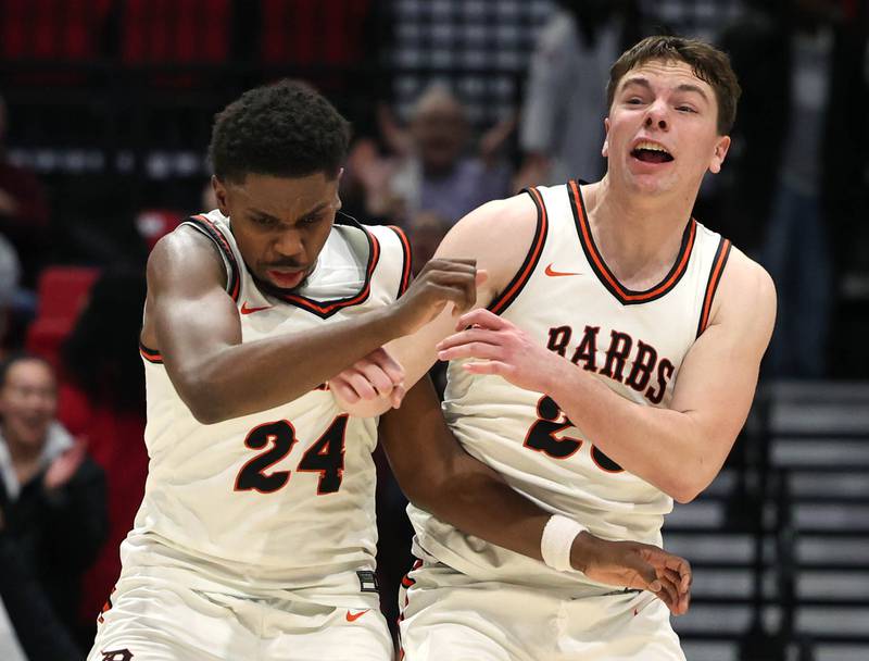 DeKalb's Myles Newman (left) and DeKalb's Lukas Stubblefield celebrate their win over Sycamore Friday, Jan. 30, 2026, during the FNBO Challenge at the Convocation Center at Northern Illinois University in DeKalb.