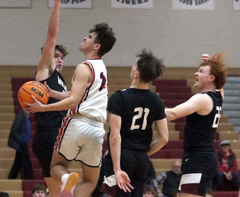 Huntley’s Casey Kaczmarski works under the hoop against Prairie Ridge in varsity boys basketball on Tuesday, Feb. 18, 2025, at  Huntley High School in Huntley.