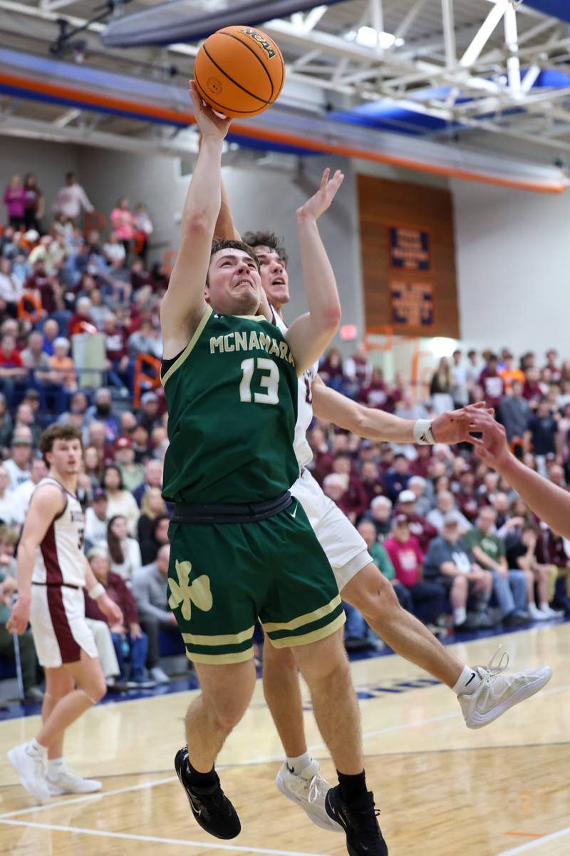 Bishop McNamara's Teddy Fogel goes for a layup under pressure during the Fightin' Irish's 77-70 loss to Tolono Unity in the IHSA Class 2A Pontiac Supersectional on Monday, March 9, 2026.