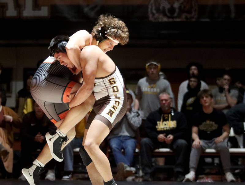 Crystal Lake Central’s Luke Hartman, left,  battles Jacobs’ Brian Ayala at 190 pounds in varsity boys wrestling on Tuesday, Jan. 20, 2026 at Crystal Lake Central High School in Crystal Lake.