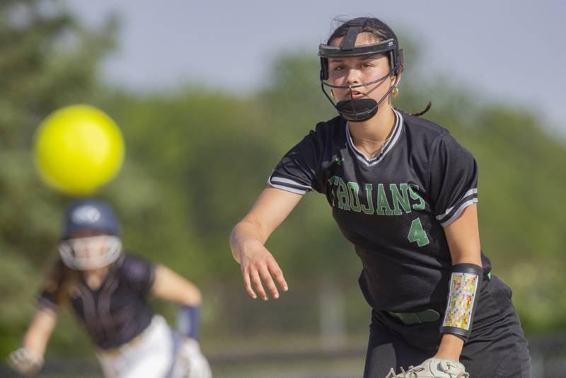 Maddy Ely of Dwight High School throws a pitch with a Serena Highschool runner in scoring position during the Class 1A Sectional semifinal game at Woodland High School on May 21, 2024.