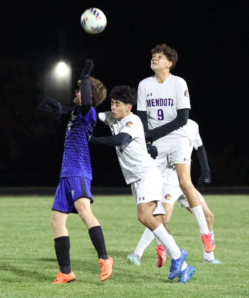 Harvest-Westminster's Alex Miron, (left) Mendota's Danny Garcia and Mendota's Abel Nanez (right) look to head the ball Friday, Oct. 31, 2025, during the Class 1A Indian Creek Sectional championship game Friday in Waterman.