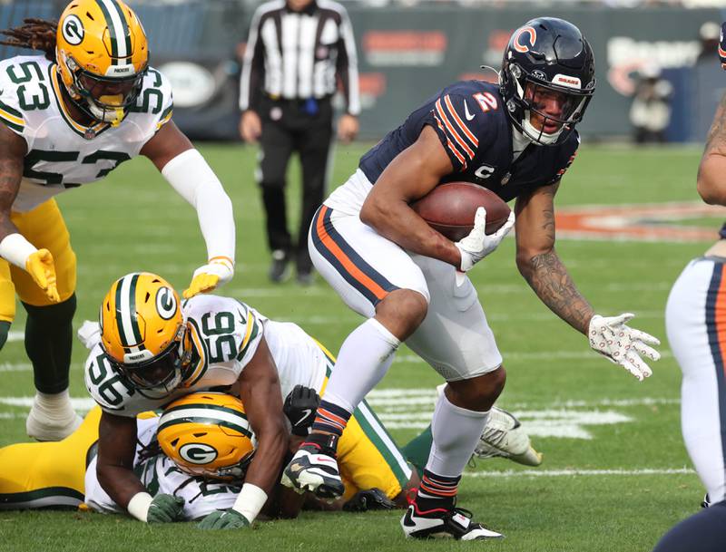 Chicago Bears wide receiver DJ Moore escapes from a trio of Green Bay Packer defenders after a catch Sunday, Nov. 17, 2024, during their game at Soldier Field in Chicago.