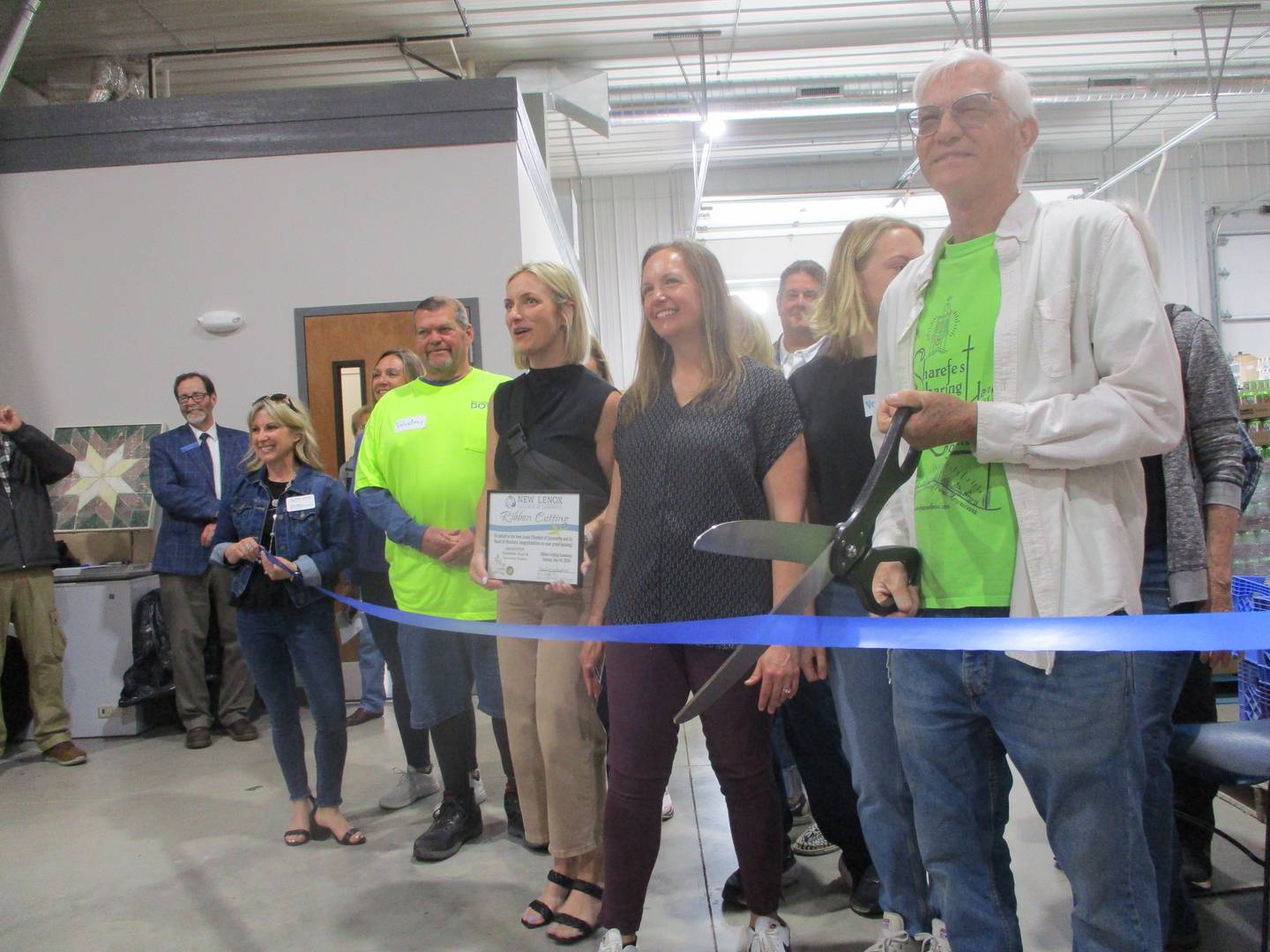 Sharefest founder Gary Cheney gets ready to cut the ribbon for the nonprofit's free grocery store in New Lenox. May 14, 2024